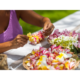 Showing a person making Leis