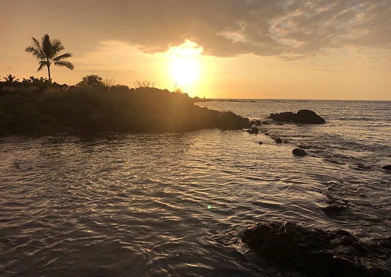 Sunset over the lava rock coastline at Kaloko-Honokōhau National Historical Park, Kona, Hawaii