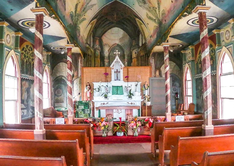 Hand-painted murals covering the interior walls and ceiling of St. Benedict's Painted Church in Kona, Hawaii